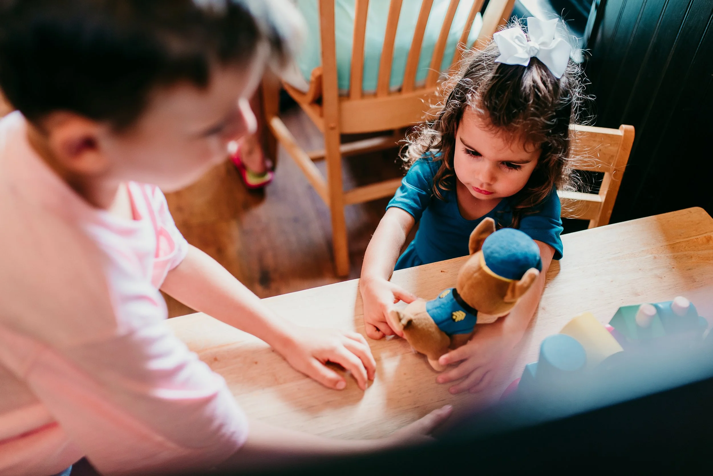 siblings playing with a toy
