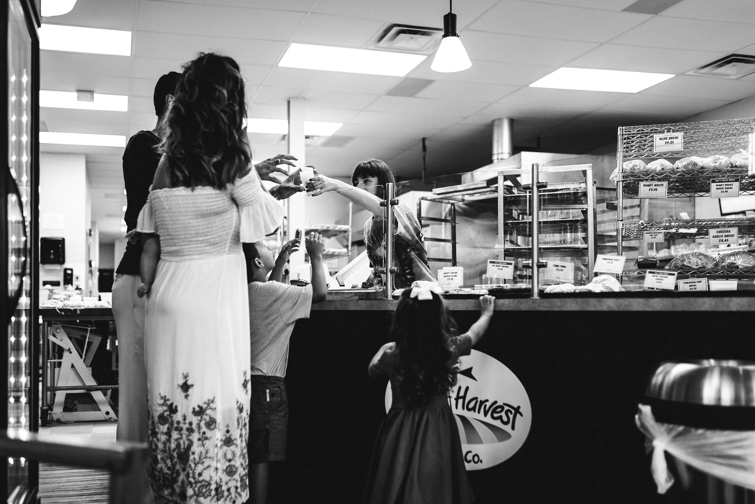 family picking out a bakery treat together