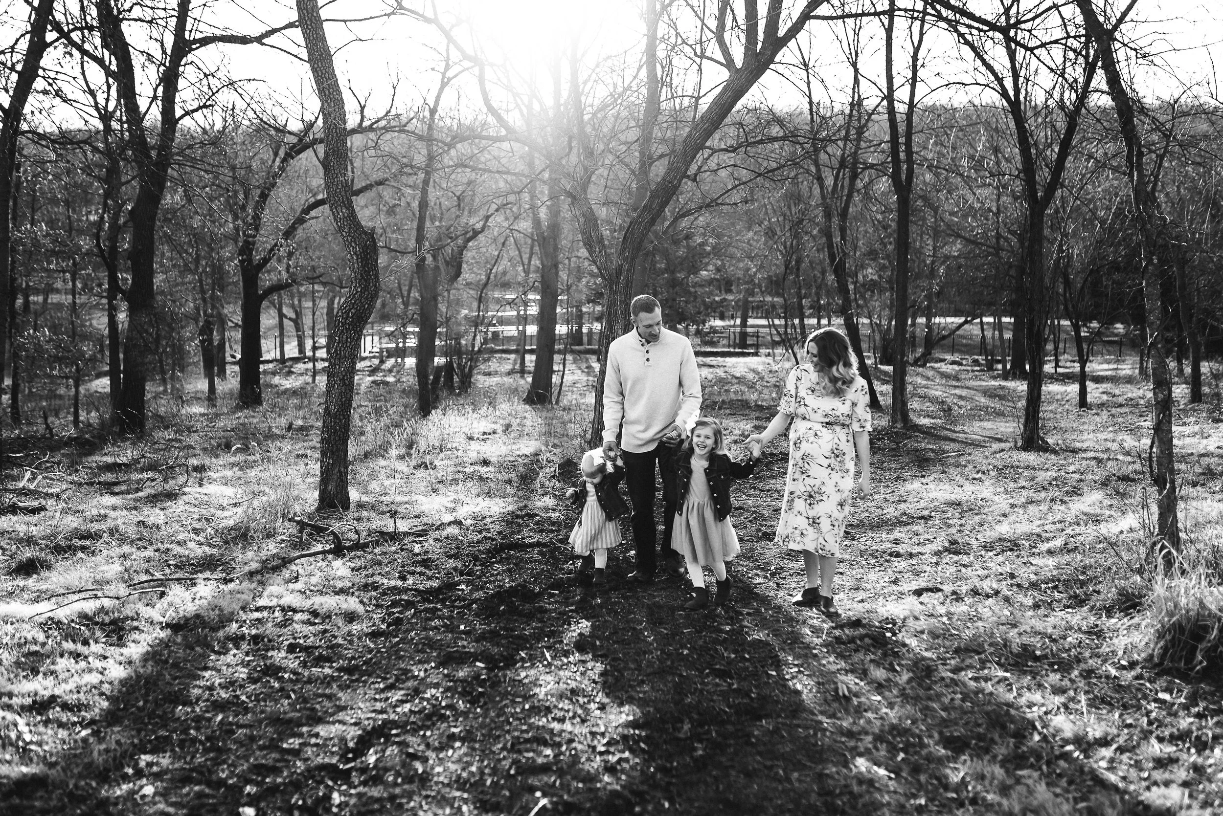 black and white image family walking