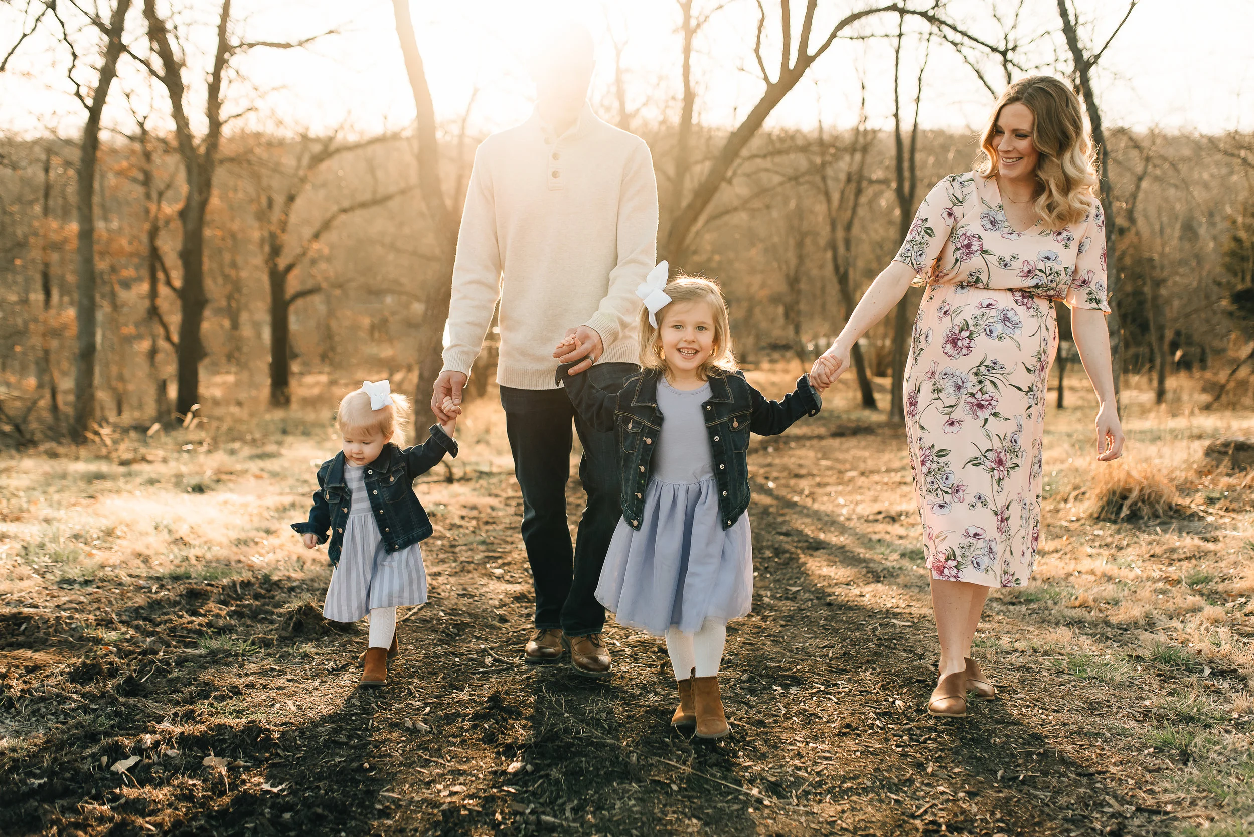 family holding hand and walking