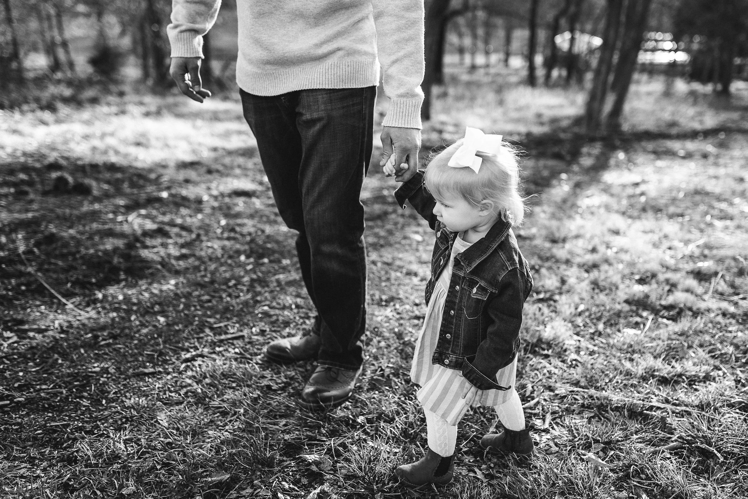 baby walking with dad