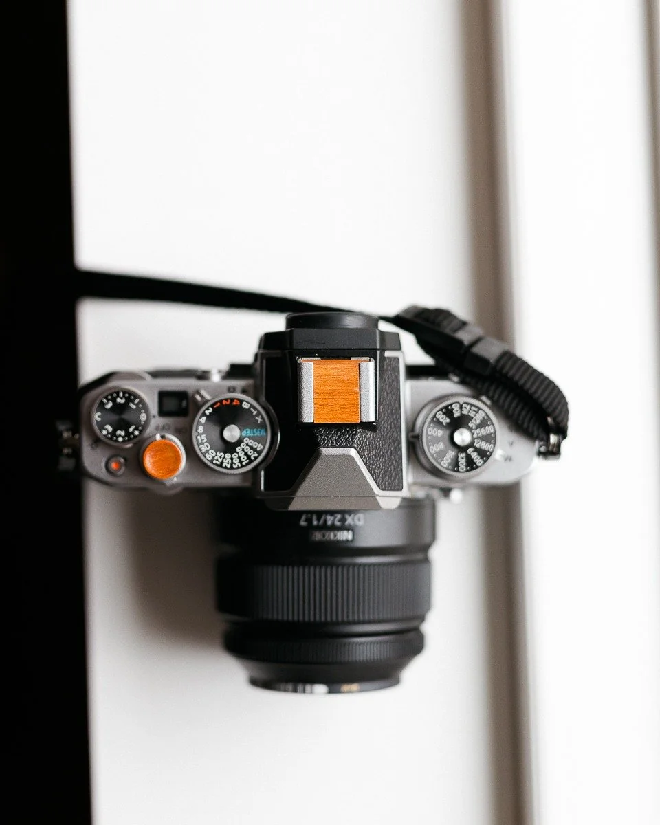 &ldquo;All photographs are accurate. None of them is the truth.&rdquo; - Richard Avedon

The camera bears witness; the maker supplies meaning. This Nikon Zfc is outfitted with a Chakte Viga hot shoe cover and matching soft release, built to steady th