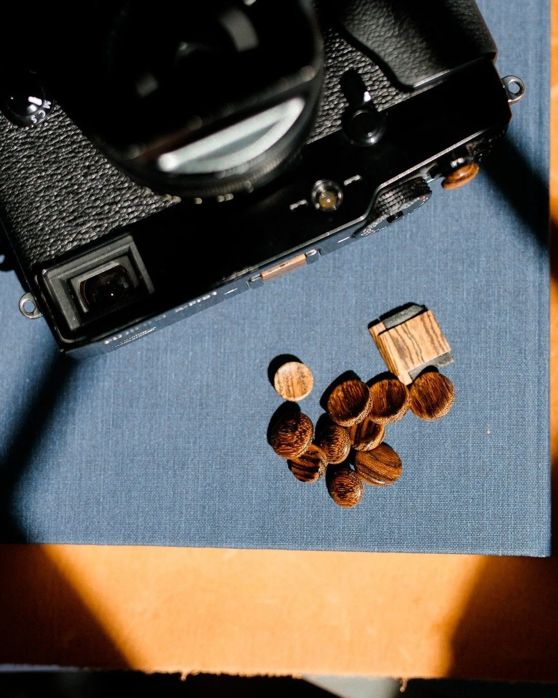 When Fuji changed their shutter thread design in late 2022, I re-engineered my brass hardware to match. Every button built before that revision&mdash;the original REG-thread design&mdash;was set aside.

Now, they&rsquo;re available again under the co