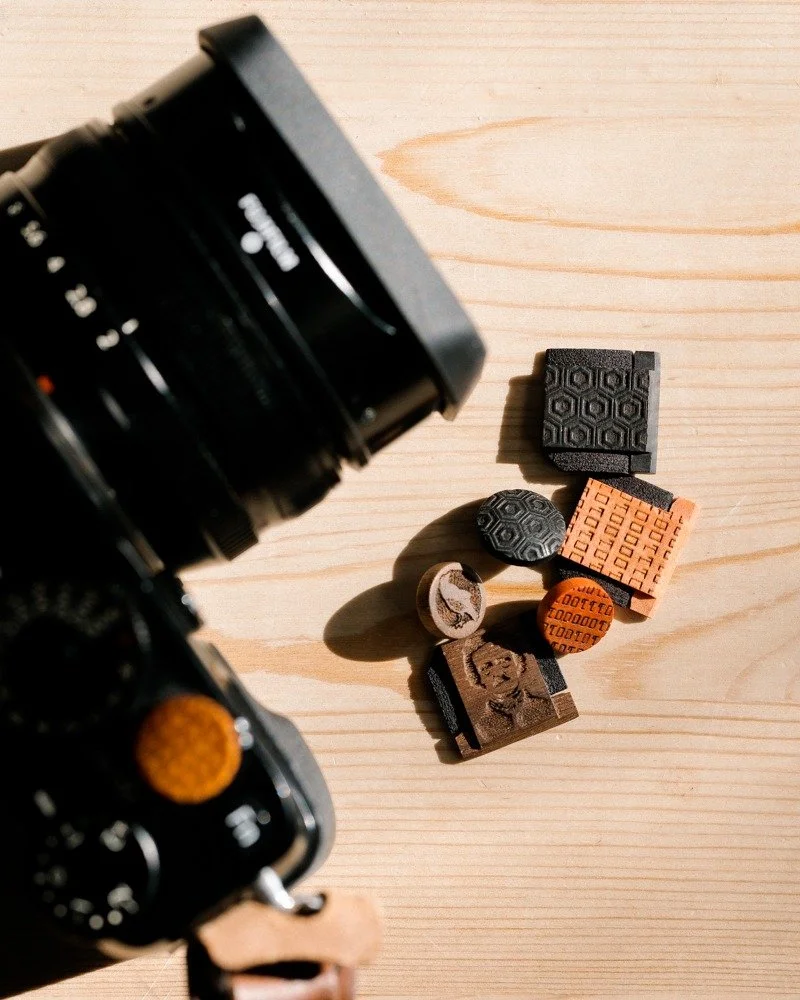 &ldquo;The marvels of daily life are so exciting; no movie director can arrange the unexpected that you find in the street.&rdquo; - Robert Doisneau

X-Pro1 with chevron-engraved Chakte Viga. Beside it: tortoise shell Ebony, Nevermore Walnut, and Bin
