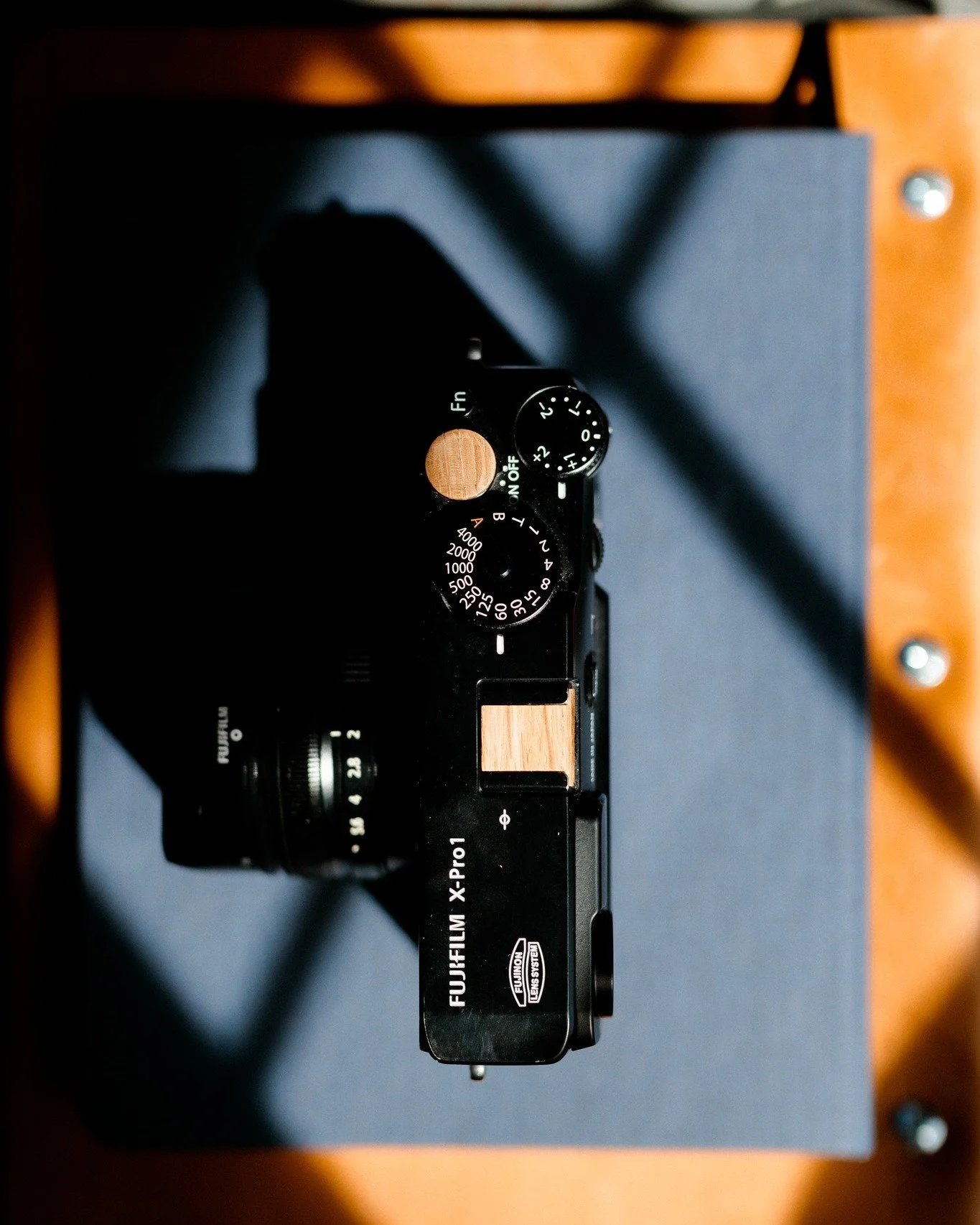 &ldquo;Photography takes an instant out of time, altering life by holding it still.&rdquo; - Dorothea Lange

My X-Pro1 outfitted with our Jack Daniels hot shoe cover and soft release. Simple, reliable, ready for work.

Holiday Sale: 20% off with 2025