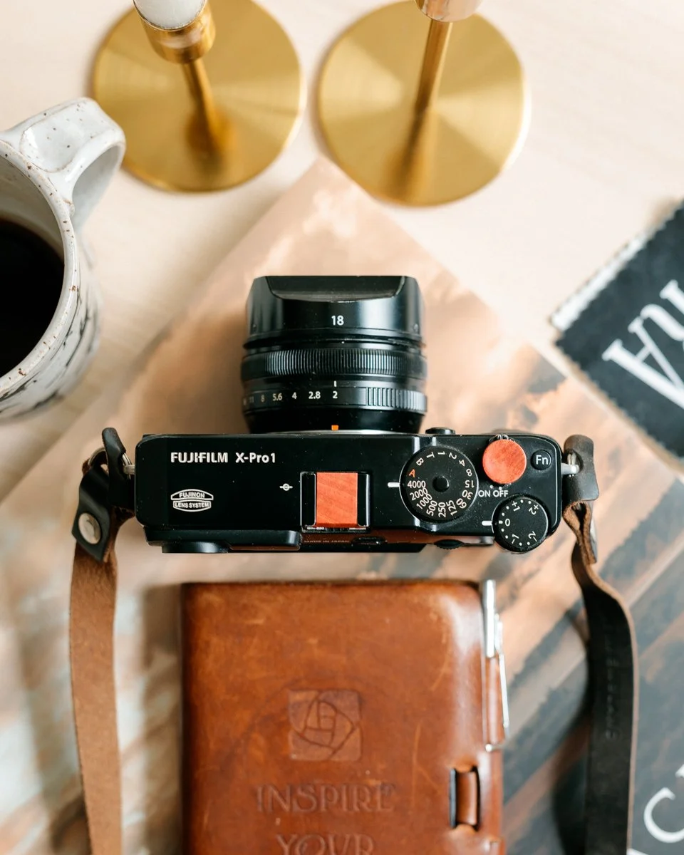 &ldquo;The camera is an instrument that teaches people how to see without a camera.&rdquo; &mdash; Dorothea Lange

Photography begins long before the shutter is pressed.

This Fujifilm X-Pro1, outfitted with an Ivorywood soft-release button and a mat