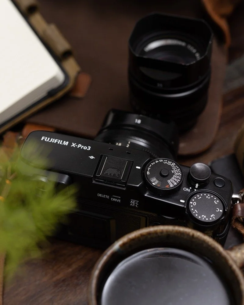 &ldquo;The eye should learn to listen before it looks.&rdquo; &mdash; Robert Frank

There&rsquo;s something about carrying a camera slowly that changes what you notice.

This Fuji X-Pro3, fitted with a Walking Bear&ndash;engraved ebony hot shoe cover