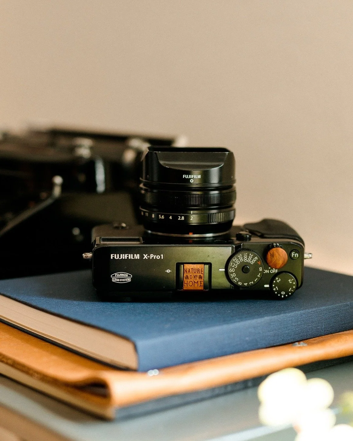 &ldquo;The camera is an instrument that teaches people how to see without a camera.&rdquo; &mdash; Dorothea Lange

This XPro1, fitted with a Nature Is My Home-engraved chakte viga hot shoe cover and matching soft release, isn&rsquo;t about adding noi
