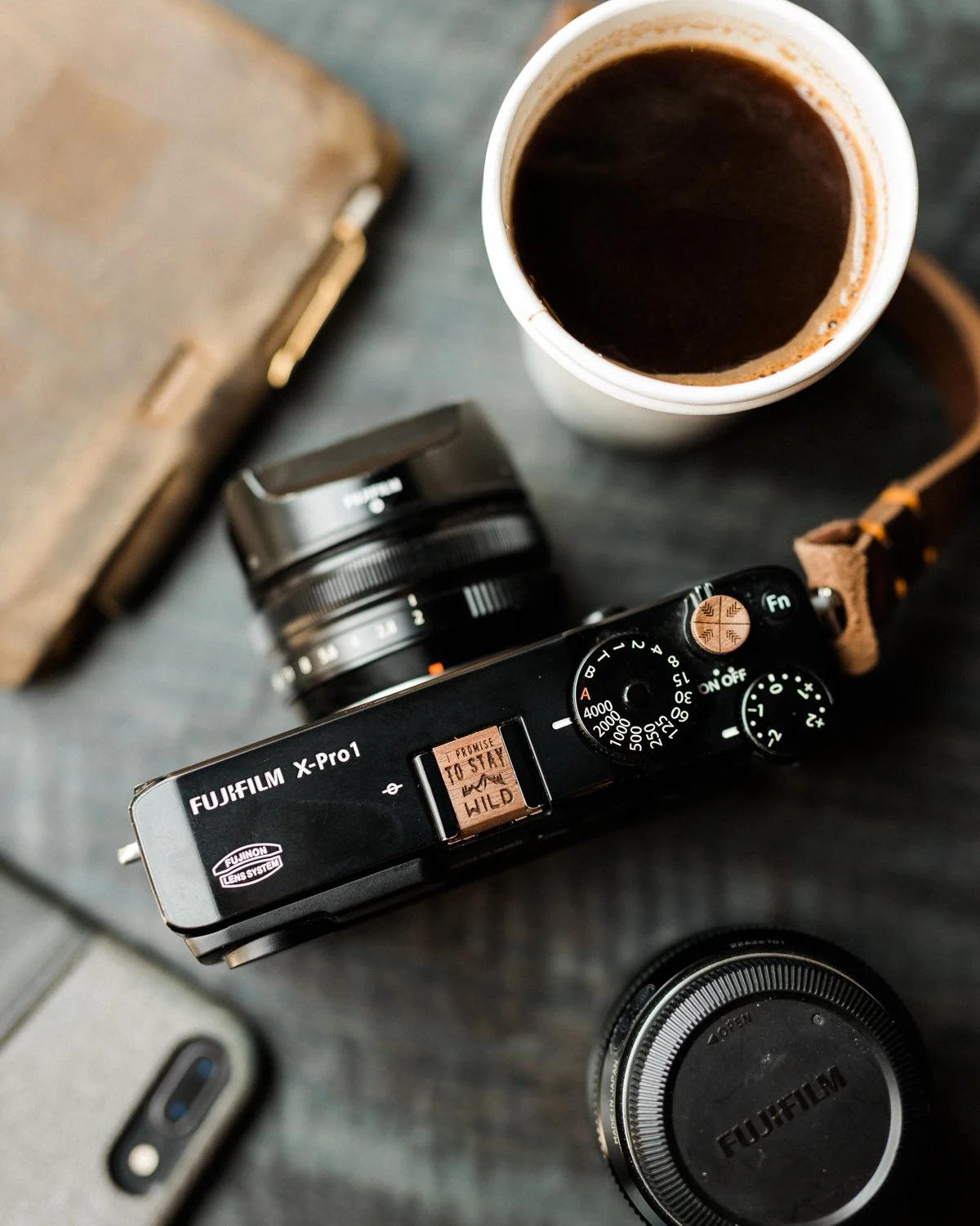 "To me, photography is an art of observation." &mdash; Elliott Erwitt

The camera doesn't ask us to travel farther. It asks us to look closer.

This Fuji X-Pro1, fitted with our I Promise to Stay Wild&ndash;engraved Walnut hot shoe cover an
