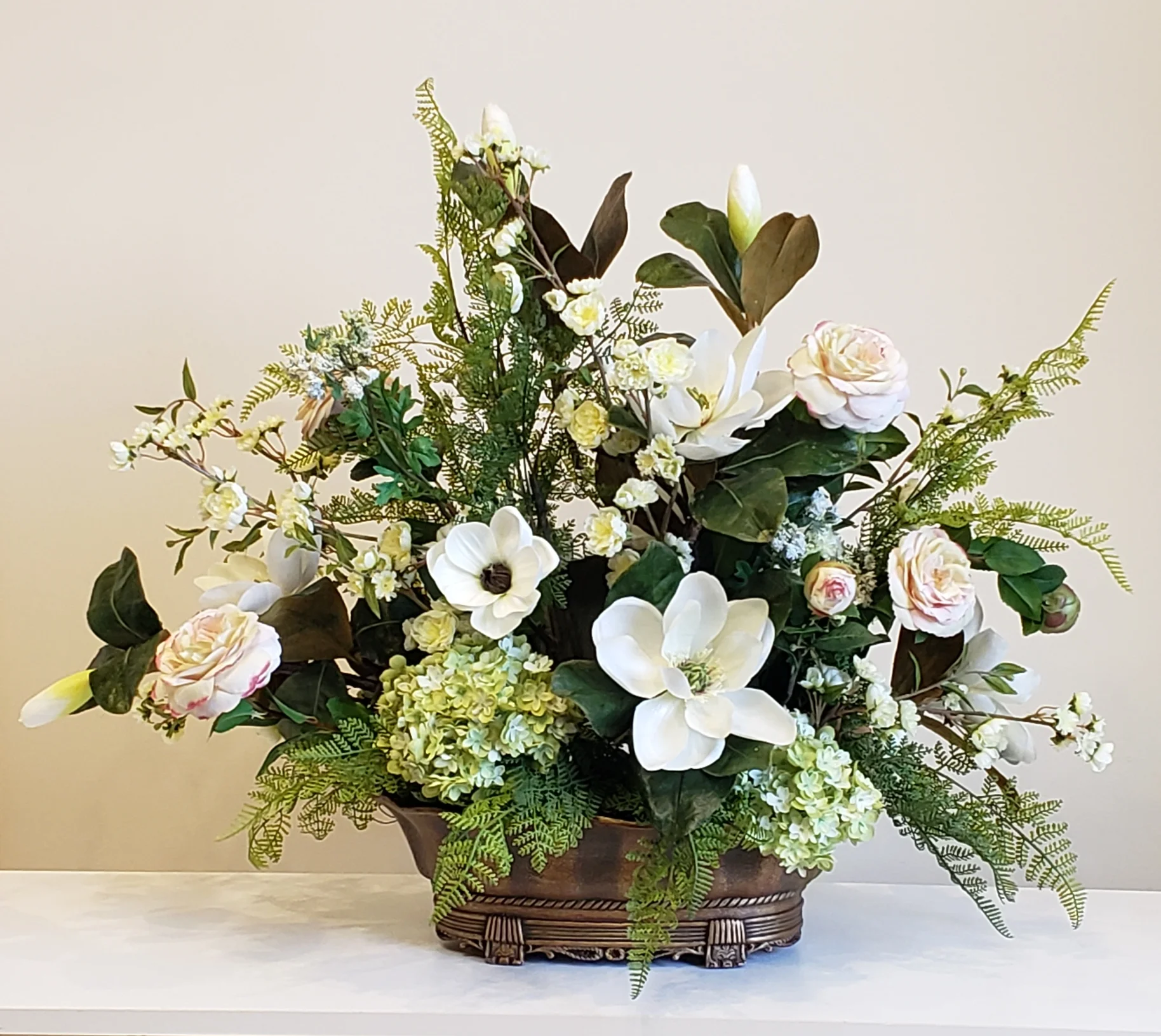 Magnolia arrangement in hotel lobby