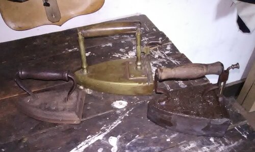 The three irons, from left to right are the solid cast iron, the brass iron with a slug and the cast iron with a slug.