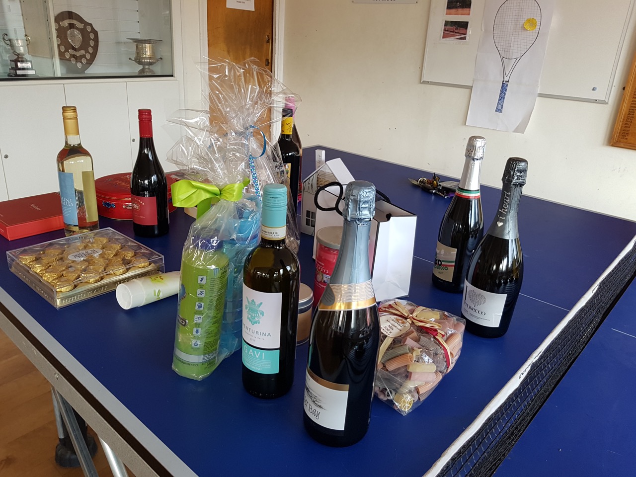 Table of raffle prizes at Dorking Tennis Club Winter Tournament fundraising for GRACE