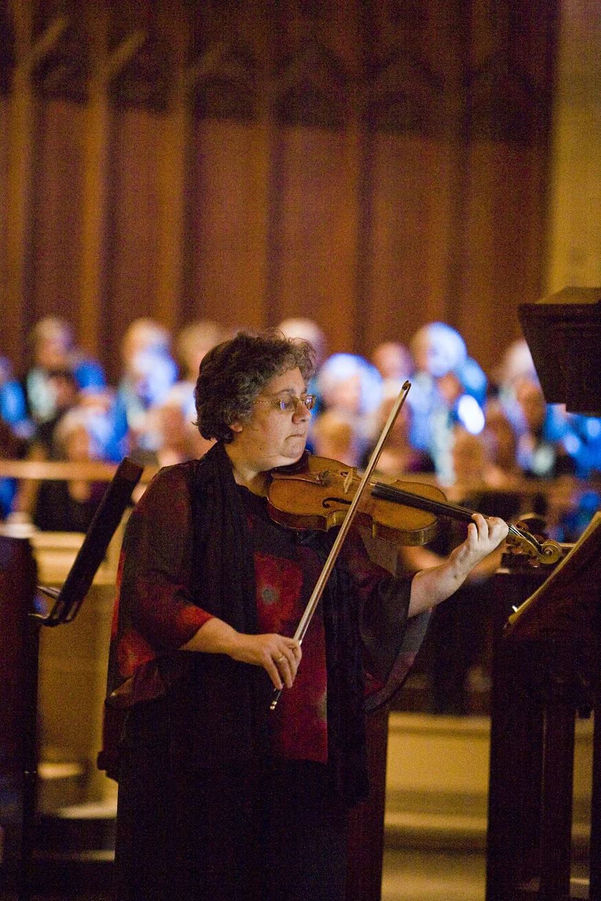 Woman playing violin at Charterhouse Spring Concert for GRACE