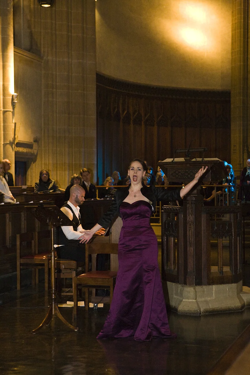 Woman singing at Charterhouse Spring Concert for GRACE