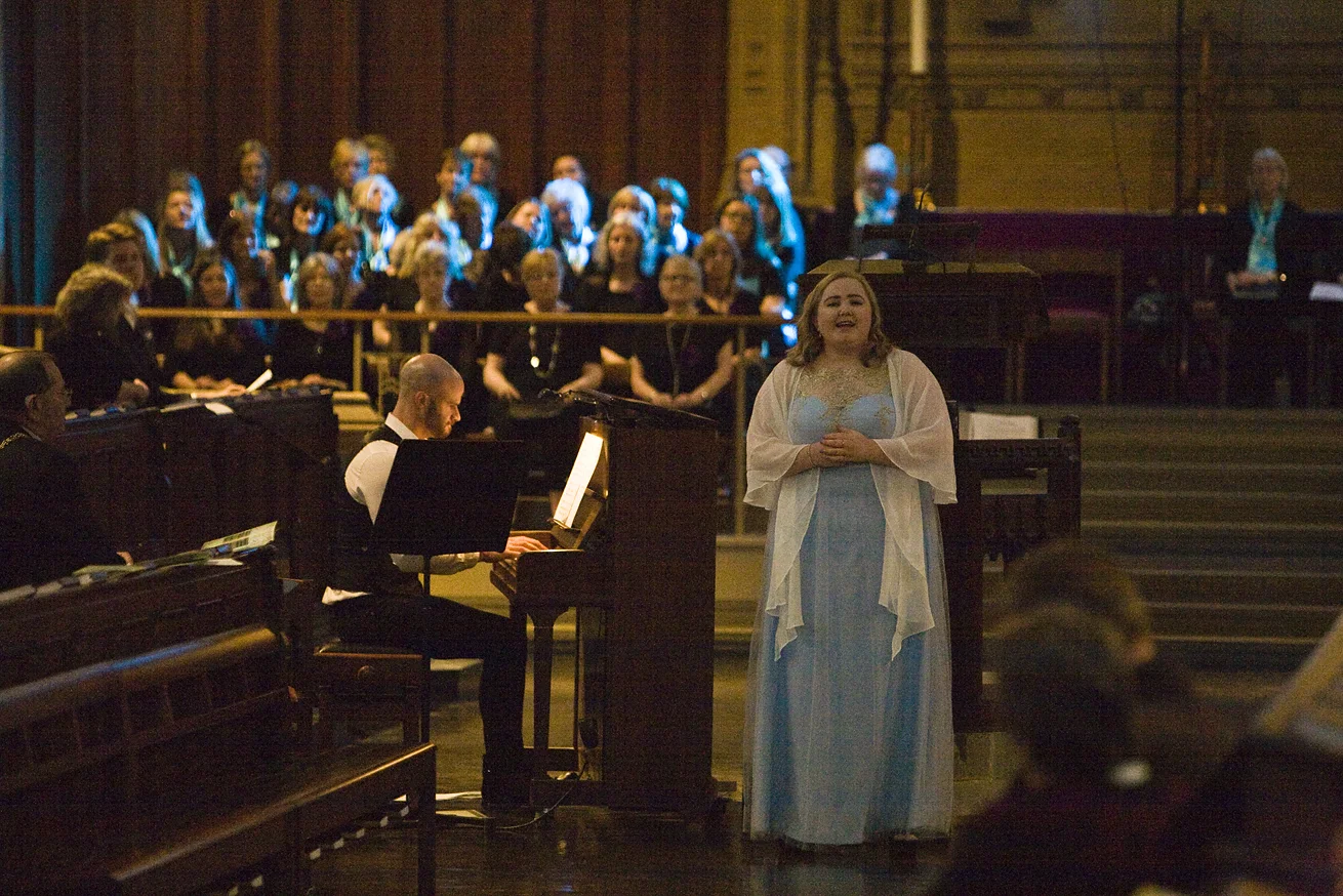 Woman singing at Charterhouse Spring Concert for GRACE