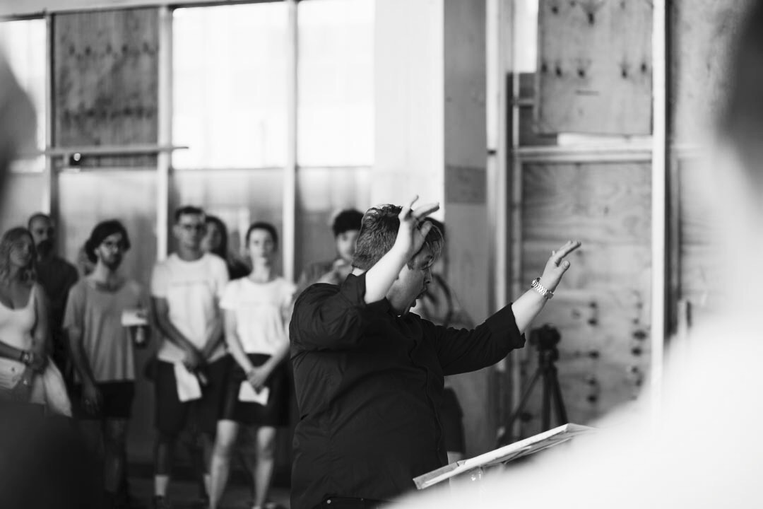 Guest conducting London Metropolitan University's Musarc Choir in Benjamin Tassie 's 'Silvertown' at the old Carlsberg & Tetley's Factory in Silvertown , London (UK); June 2017