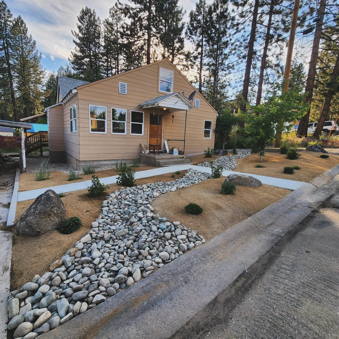 Simple, clean, low maintenance, &amp; FIRE RESISTANT. Your landscape doesn't always have to be jam packed with plants and shrubs. Improving the immediate surroundings of your home with rock, pavers, or other low ignition materials can greatly improve