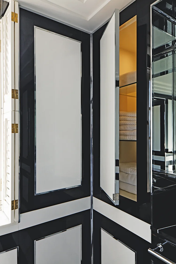 Function is of critical importance in bathrooms; each wall panel conceals storage that houses towels and other bathroom essentials. 