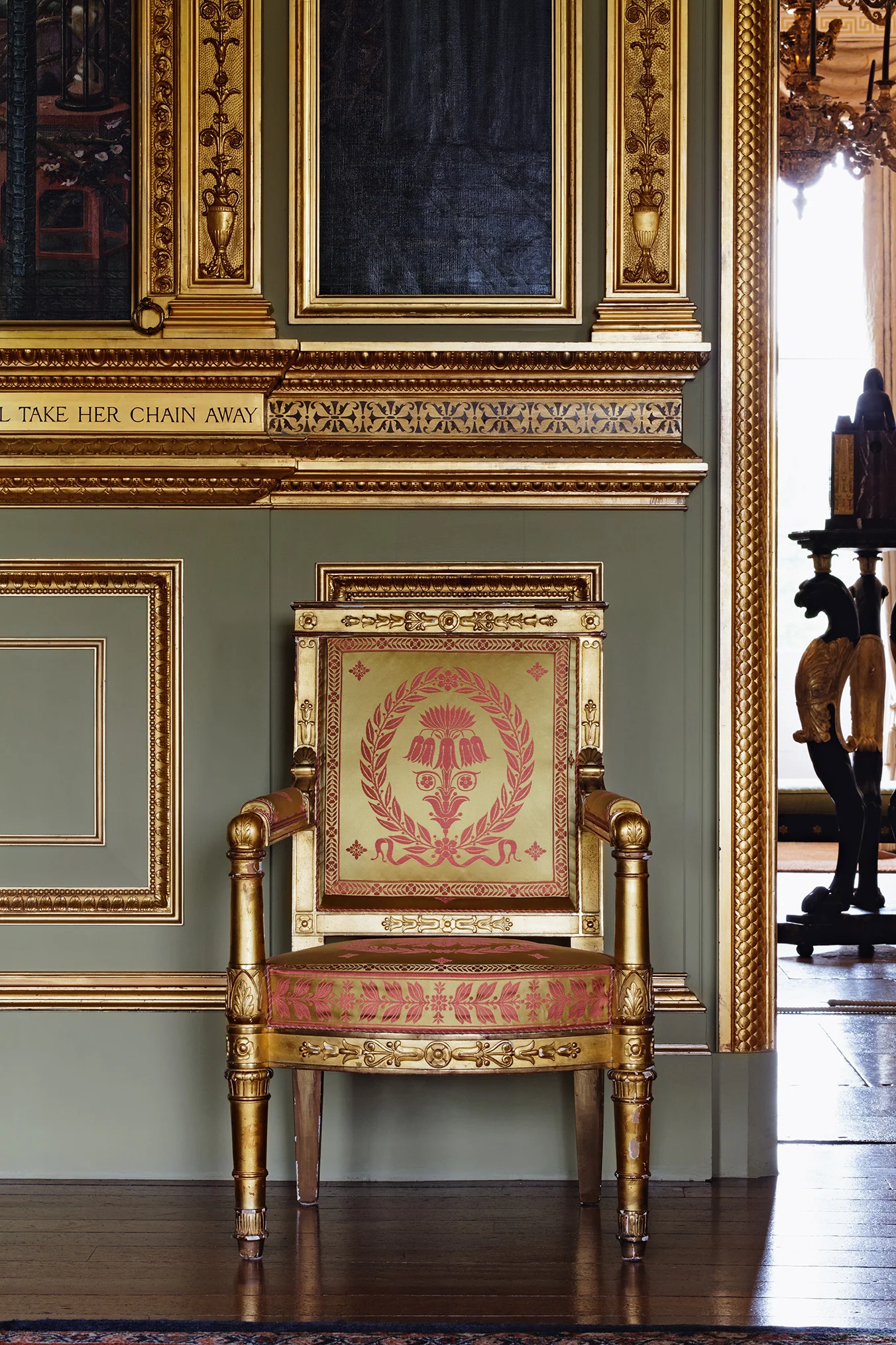 Specially woven, extraordinary perfect silk with its own subtle sheen graces this collection of Empire chairs in The Saloon at Buscot Park. Each chair has its own unique set of silk borders that had to be woven to fit the various differet sizes of the suite of existing furniture.