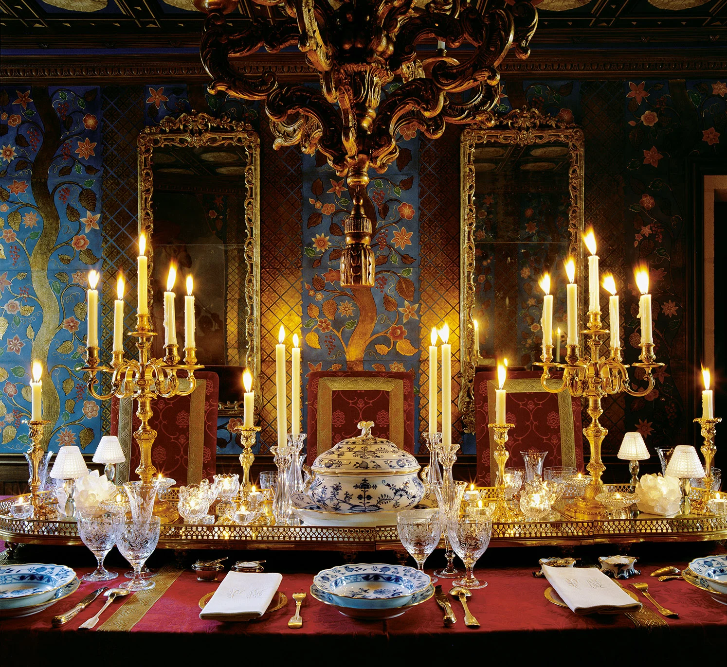 I wanted anyone who cames into this 17th century Parisian appartment to have the impression of being transported into a jewel-like box of make-believe where every vertical suface is decorated in a combination of stamped and painted leather. There is no sign of electricity, although it is there, hidden and used purely for the practocal purposes of being able to see to clean the room.