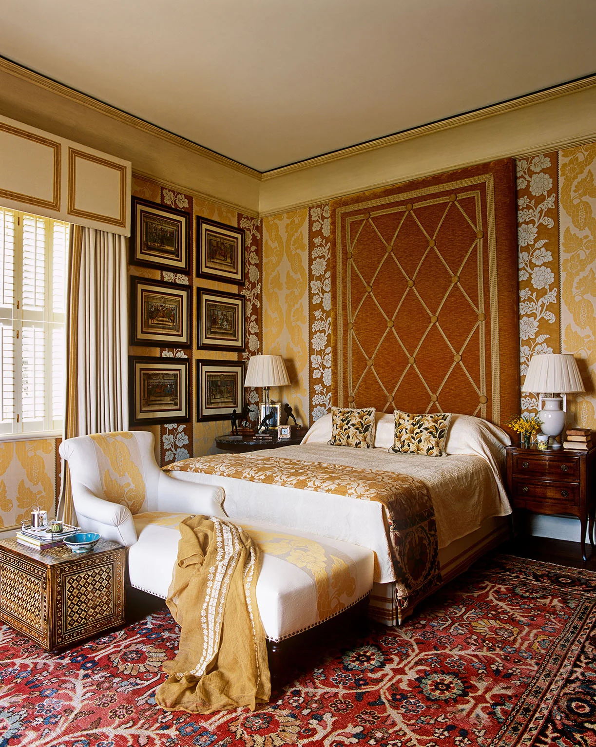 The main guest room in this house has been kept intentionally neutral, tending toward an almost masculine mood. The velvet, braid and button headboard is typically upscaled for the purposes of improving the proportions of the architecture. 