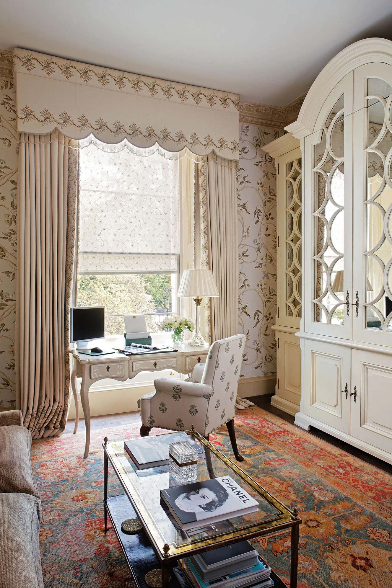 The handpainted wallpaper in this ladies' study brings an element of the garden in, but also makes the room feel larger than it is. In place of a bookcase of filing cabinets, I had this vast and beautifully overscaled cabinet built to house all paperwork and files.
