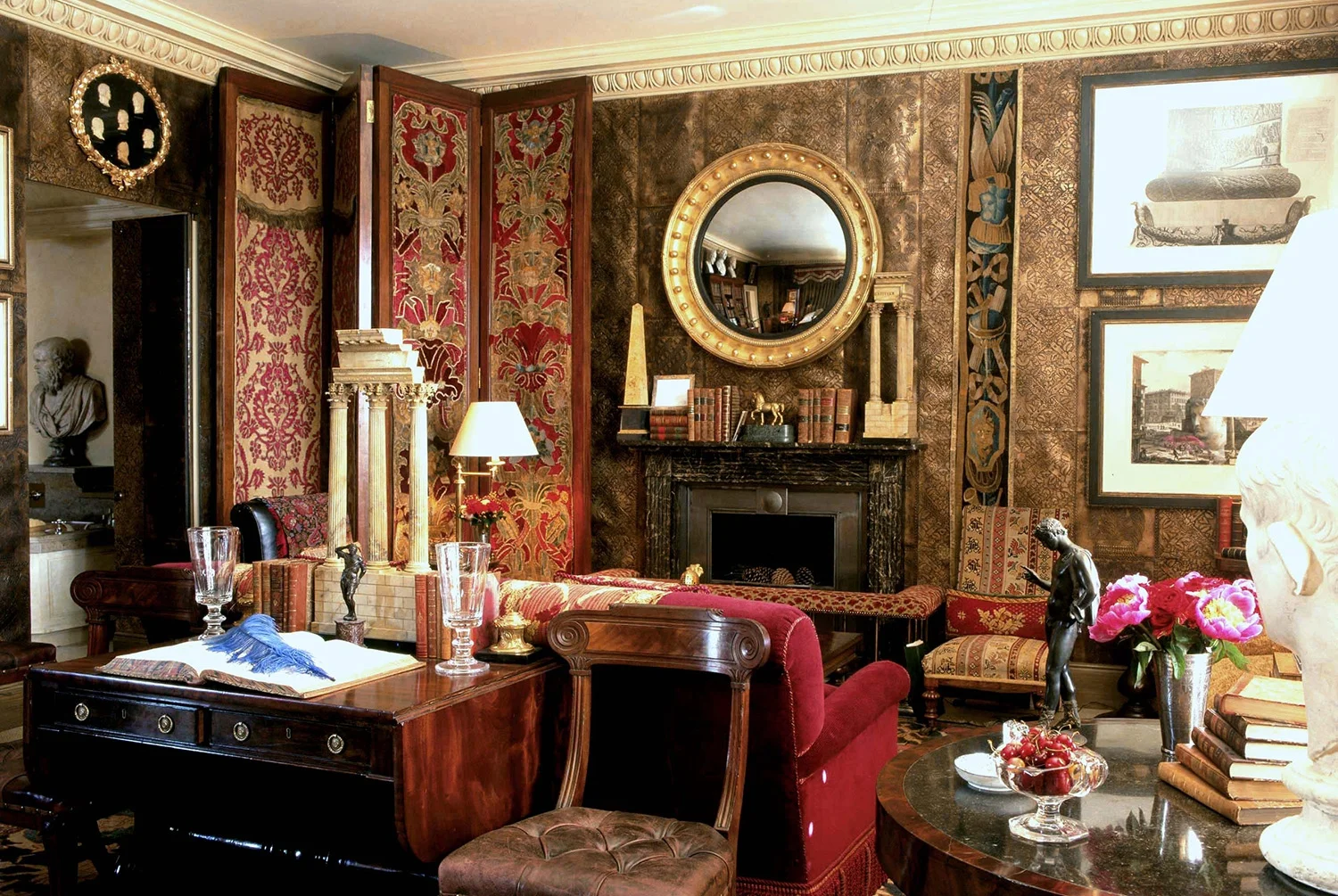 I like to use screens in my rooms as a way of creating drama, often to hang thing on. In this London sitting room the height of the screen adds height to the room.