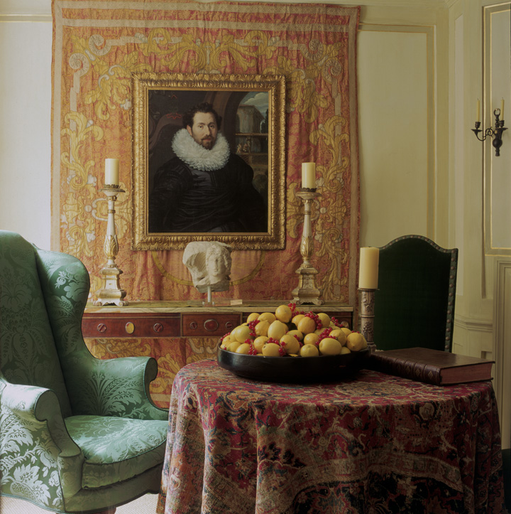 The portrait of this be-reffed seventeenth-century gentleman hangs over an eighteenth-century textile, put with the antique chairs and rare carpet used as a tablecloth, there is a real sense of historical intrigue and authenticity in this hall, all created from scratch in 1999.