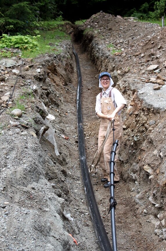  Pulling electrical cable from the turbine building to the monastery’s electrical room. 