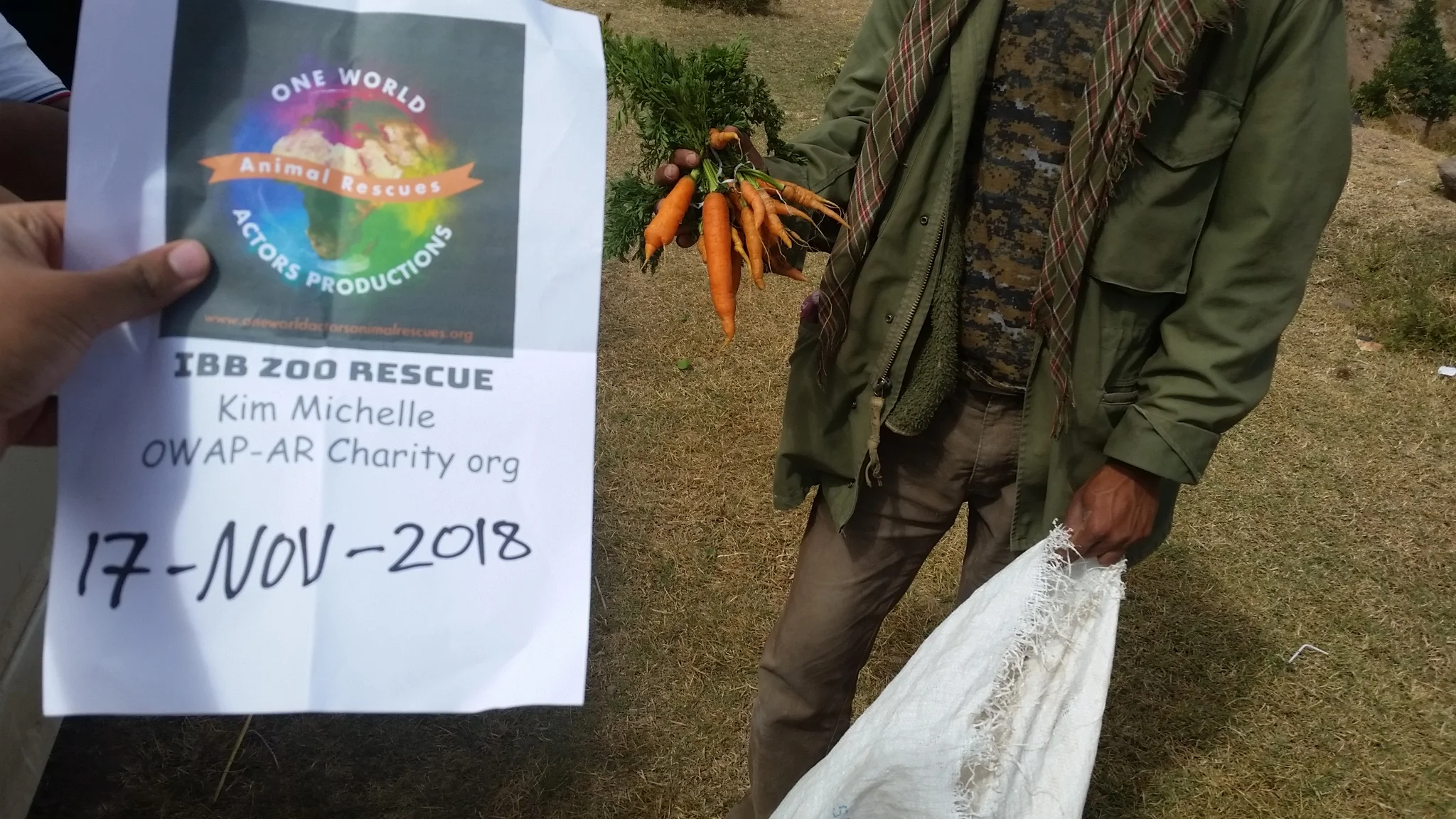 ibb zoo rescue carrots 17 NOV 2018 with our OWAP-AR sign giving horses baboons camels hisham with Abdul razak.jpg