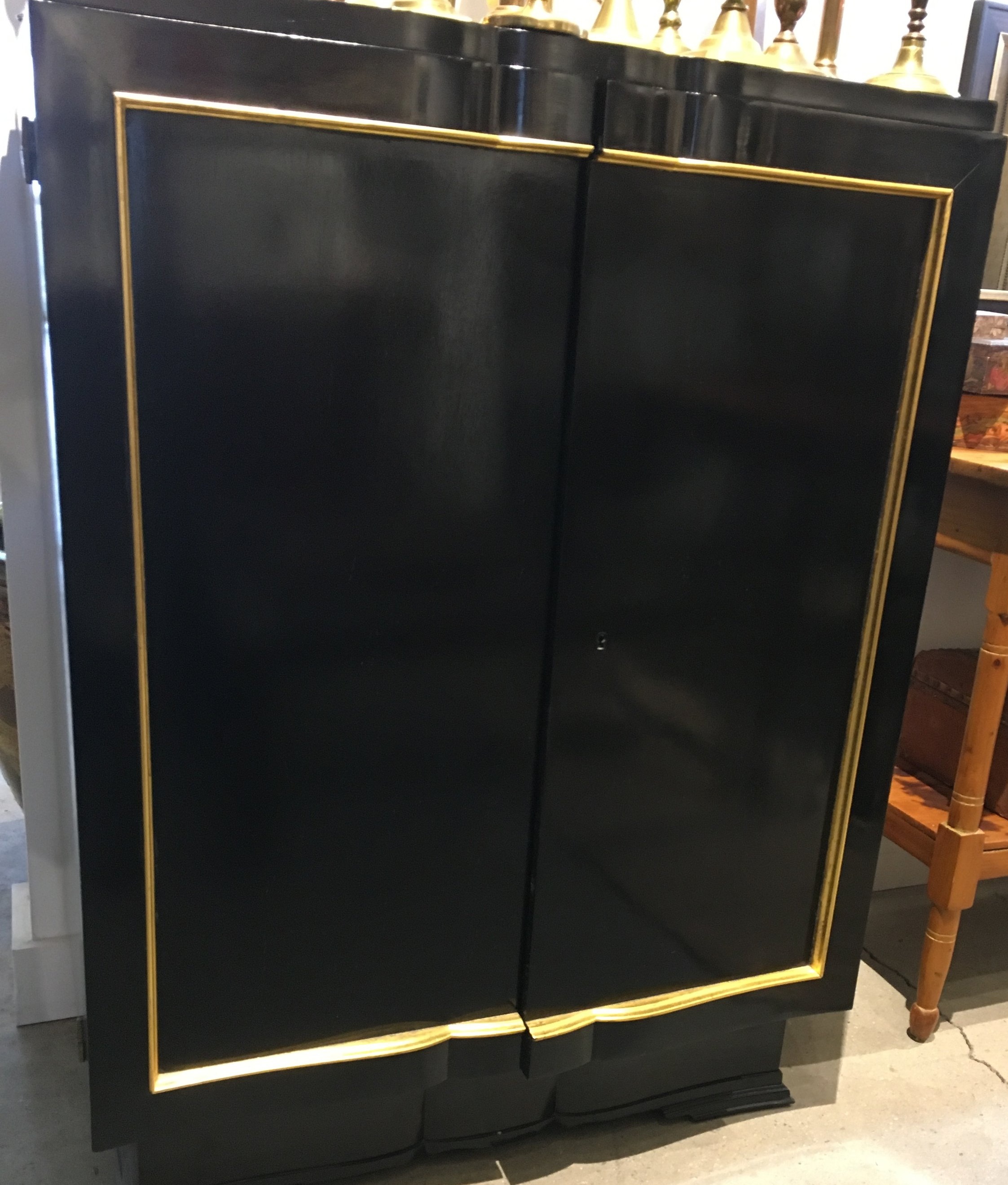 Black bar cabinet with gold trim