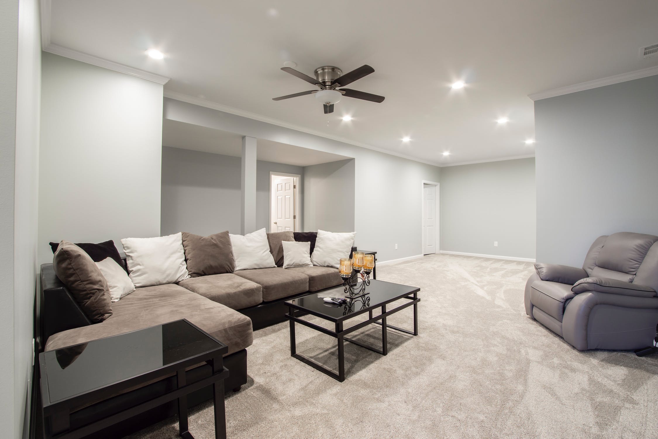 On the other end of the spectrum, we have this…not WRONG exactly, but sooooo boring. Taupe and gray and pattern-free. Even the throw pillows are yawning! And I’m pretty sure the candles are plotting an escape.