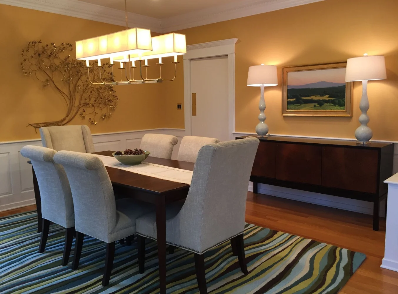 This pair of gourd lamps works perfectly for the room - they are a good height for the 9’ ceilings and a nice weight with the chunky sideboard. The color and curves echo the chairs and rug.