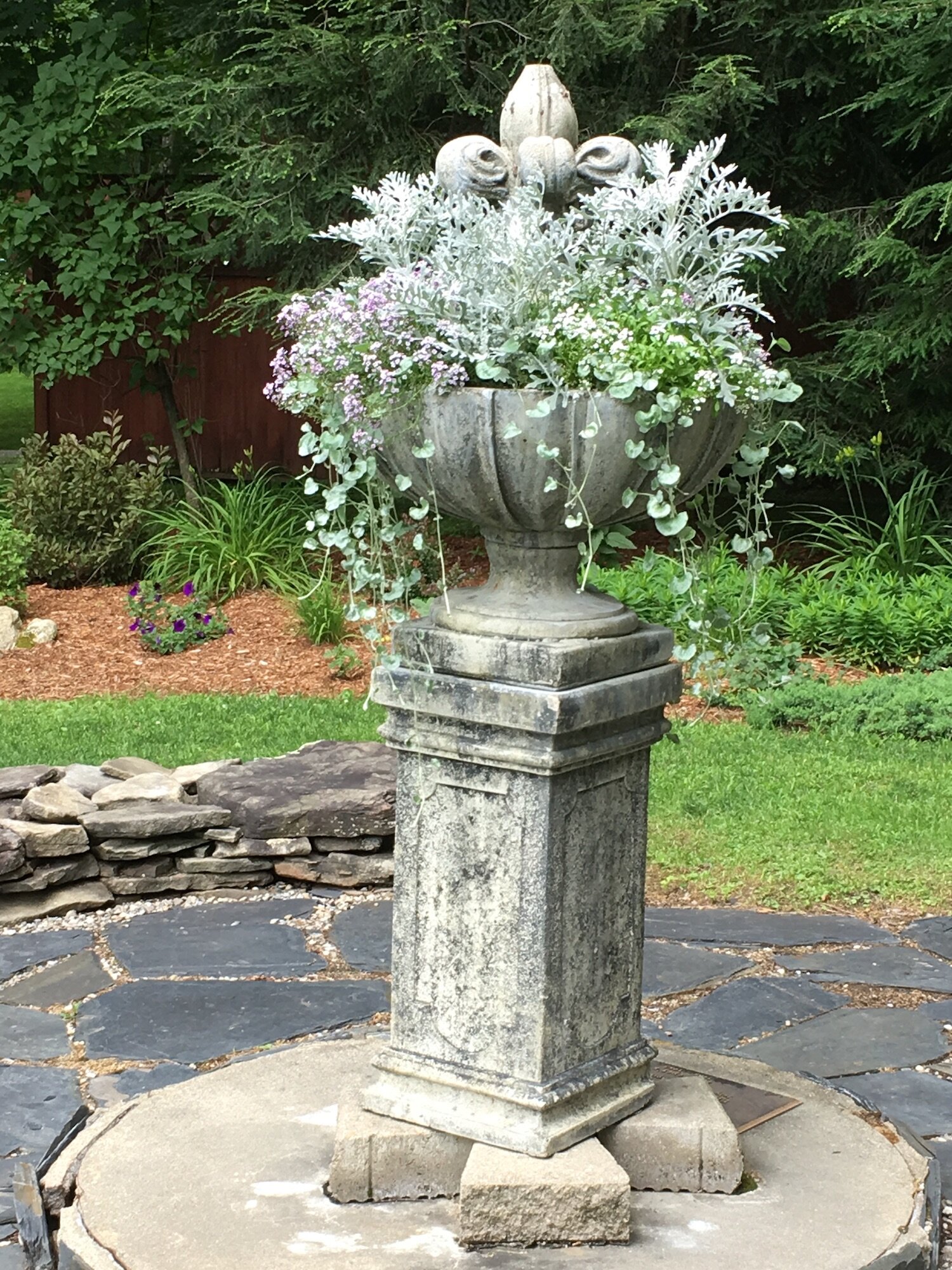 garden pedesal with urn of flowers.jpg