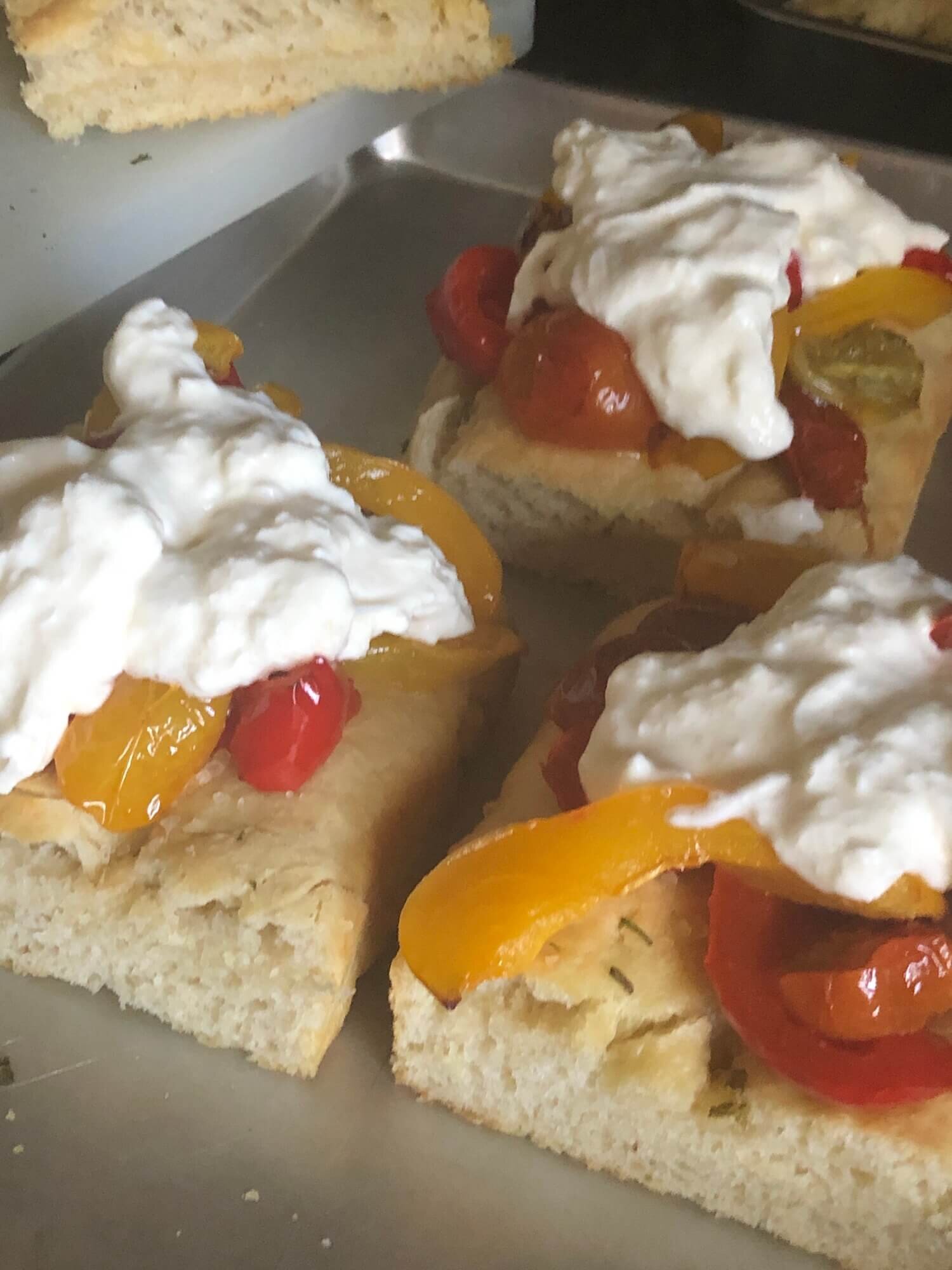 focaccia topped with roasted veggies and burrata.JPG