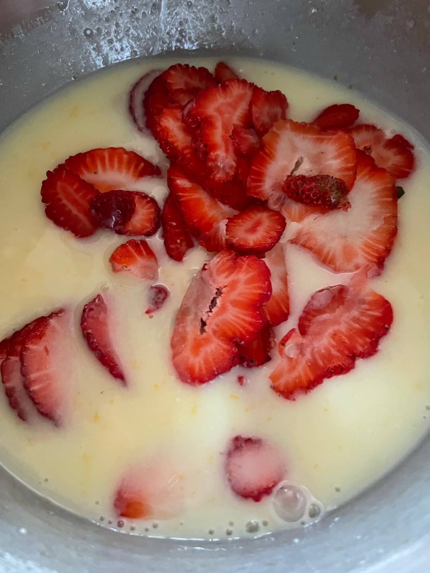 Mixing in the strawberry slices.jpg