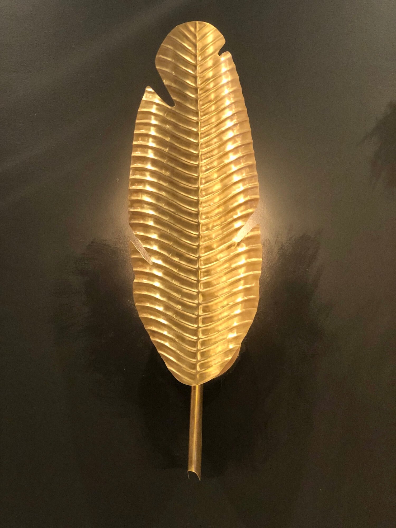 palm frond sconce at Currey