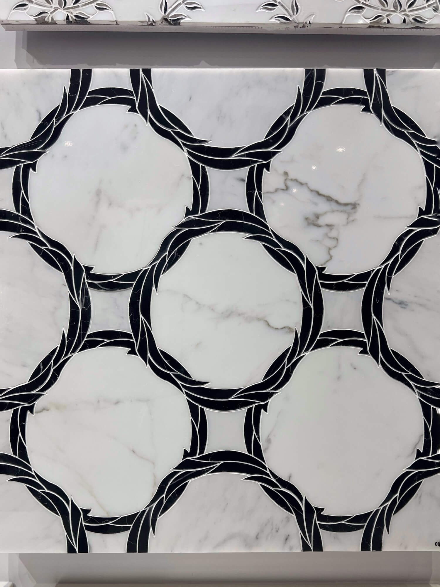 waterjet black and white leaf ring tile.JPG