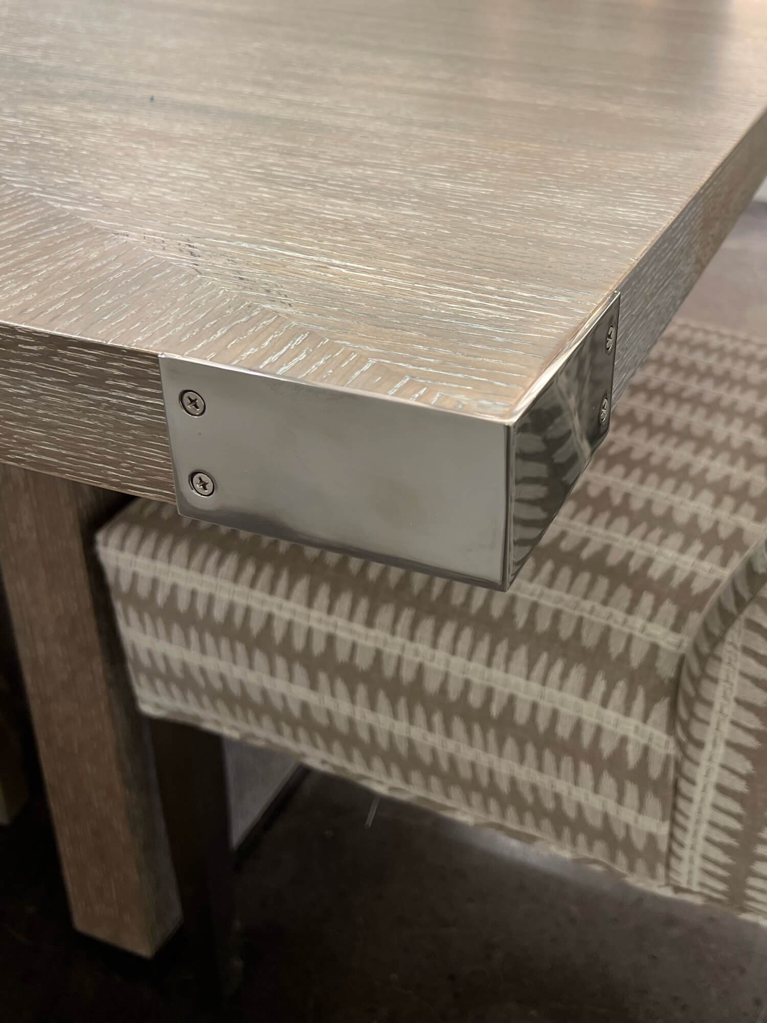 table with metal corner detail