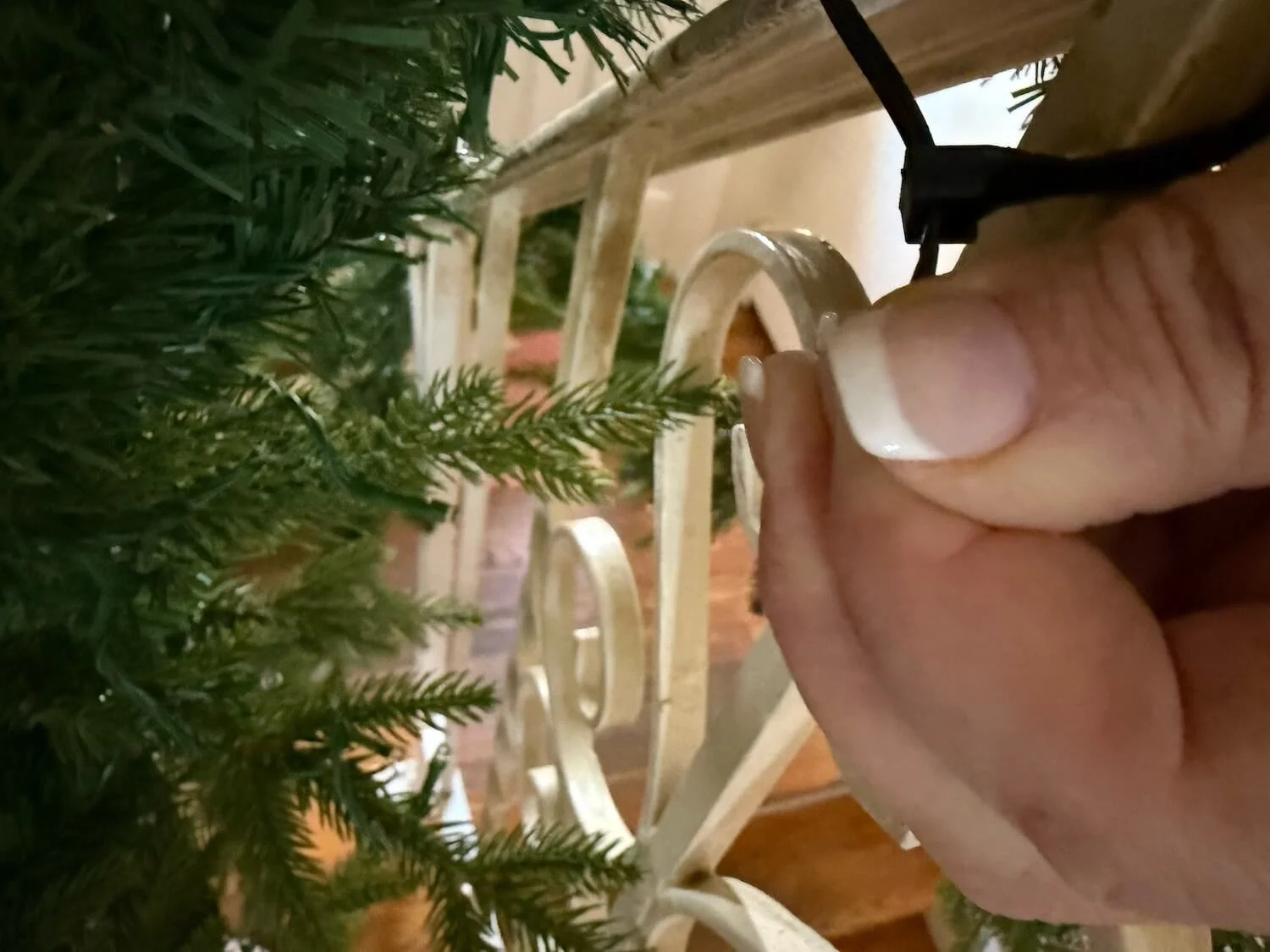 attaching the garland with cable ties.JPG