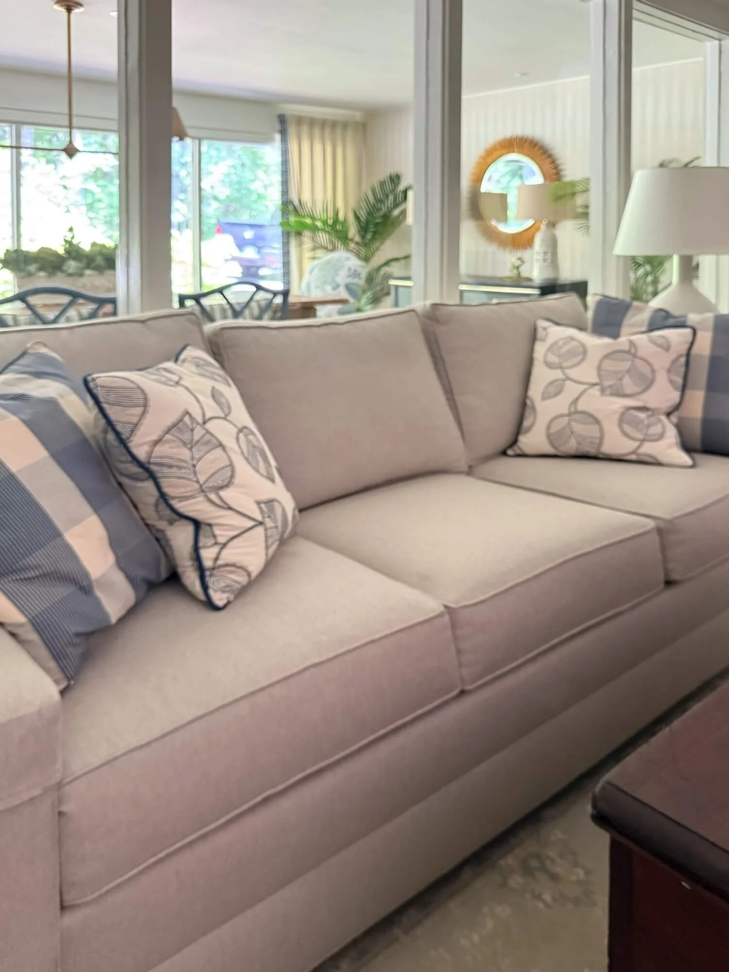 TV room sofa with pillows.jpeg