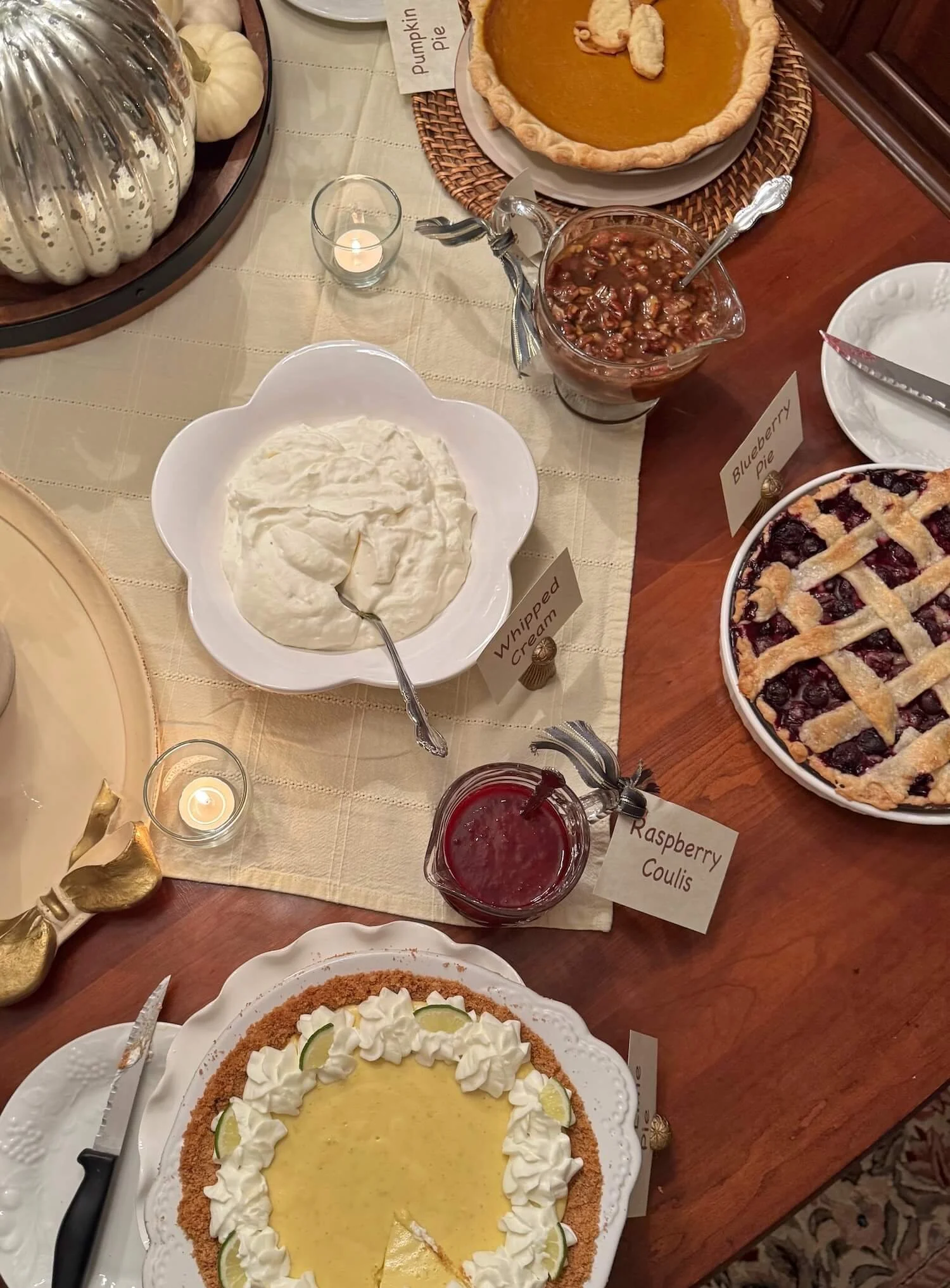 pie table wih votive candles.JPG