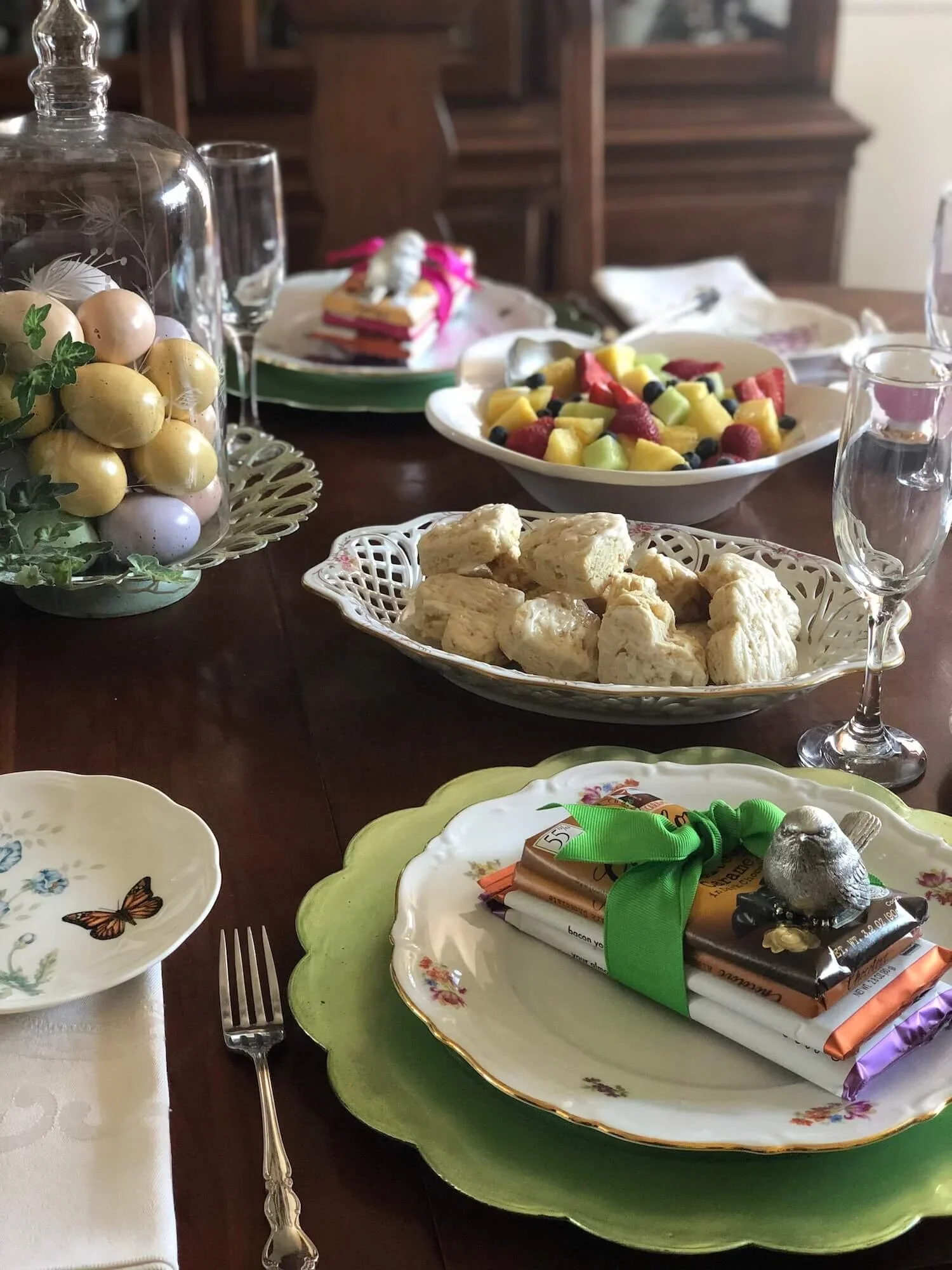 brunch table with ribbon tied stack of gourmet chocolates