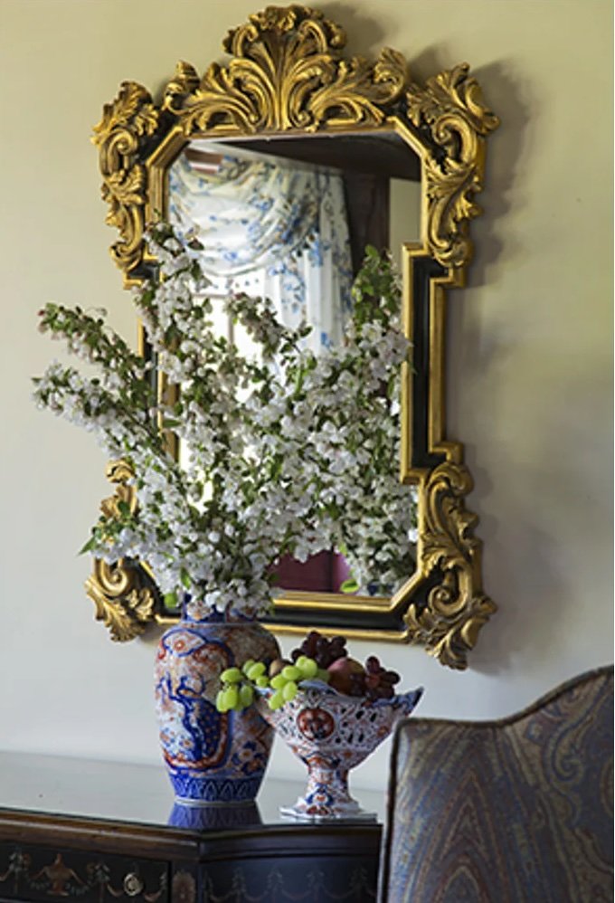 formal dining room with mirrors