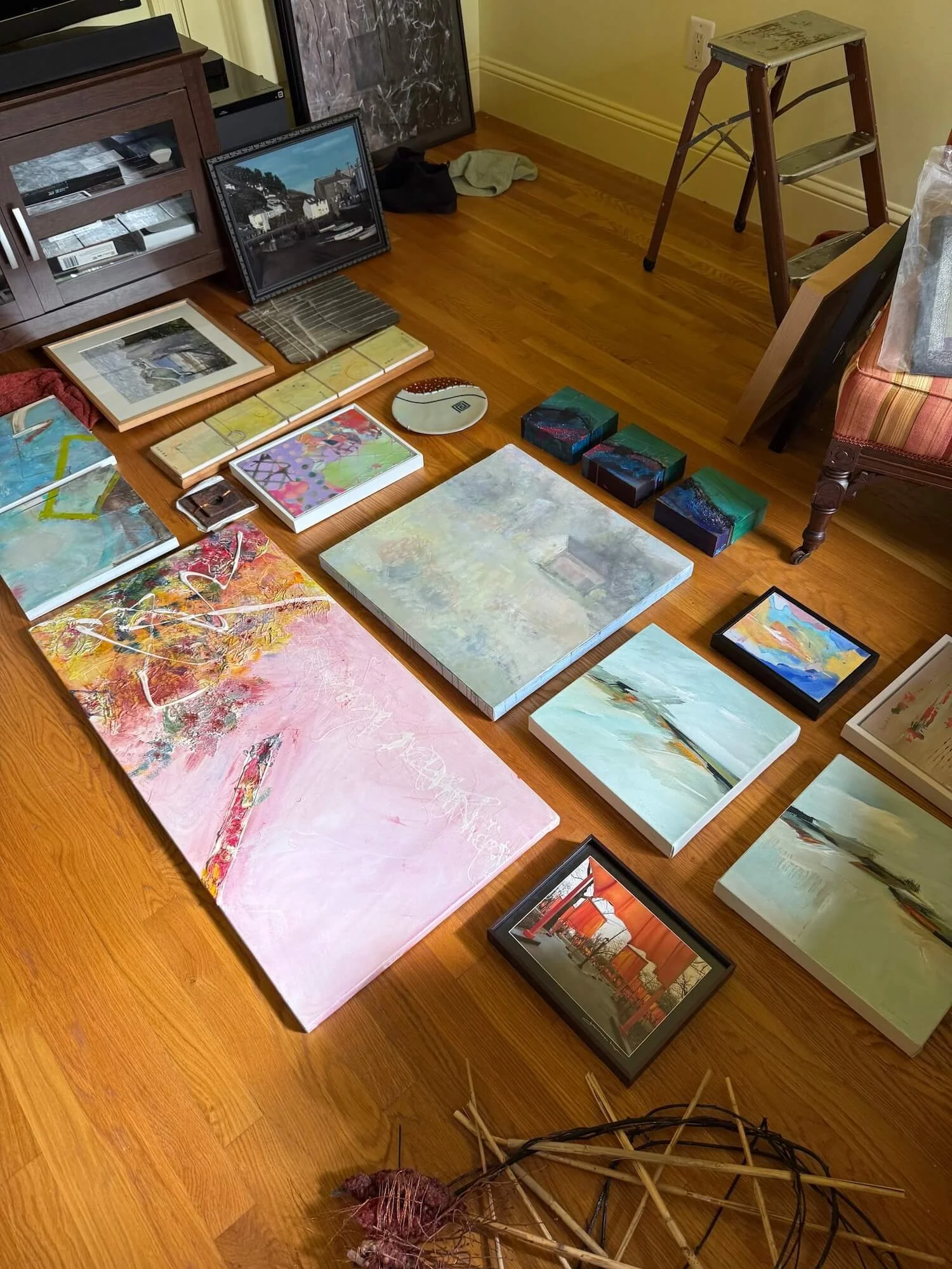 arranging art gallery pieces to hang