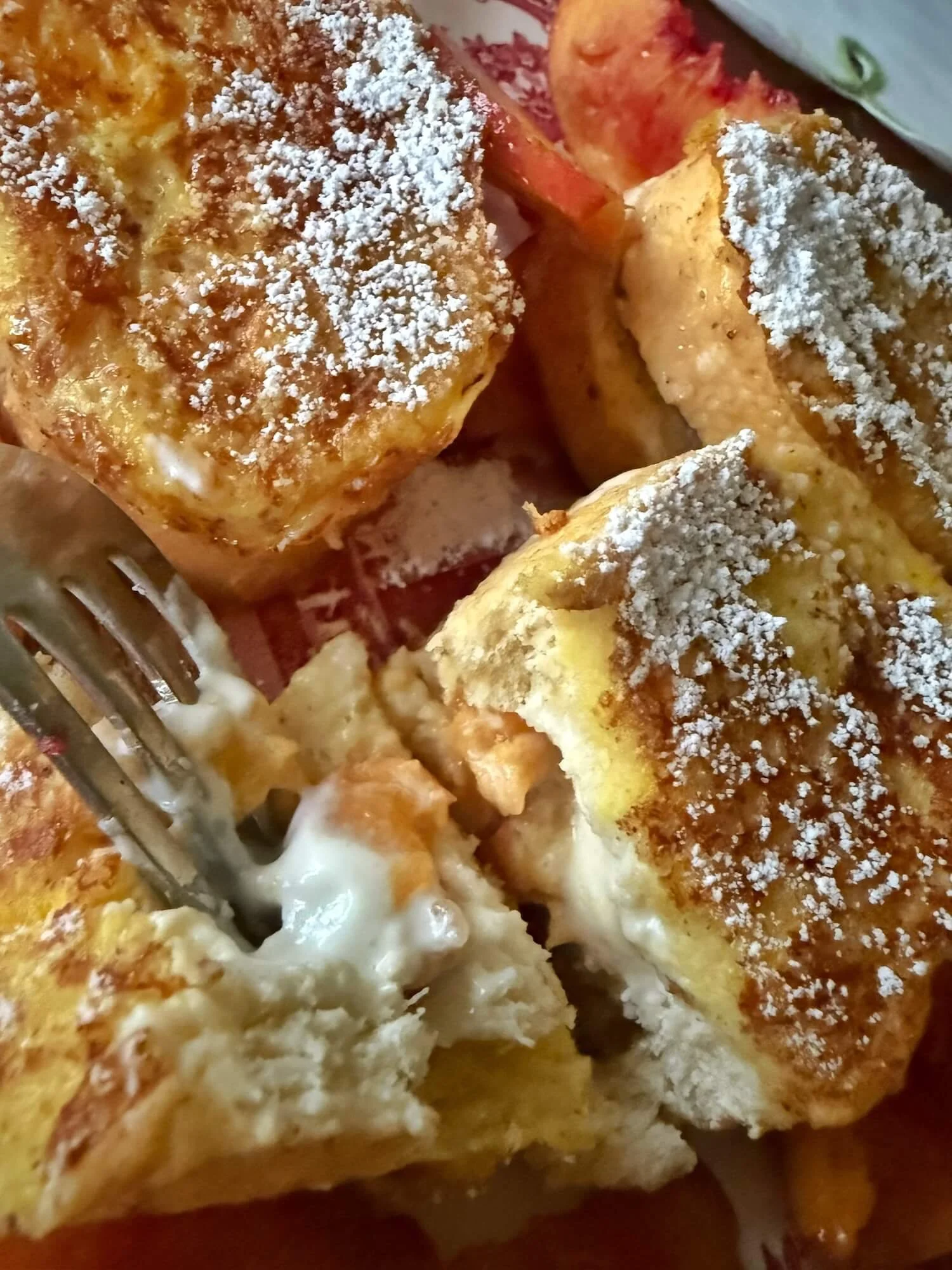 forkful of peach stuffed french toast