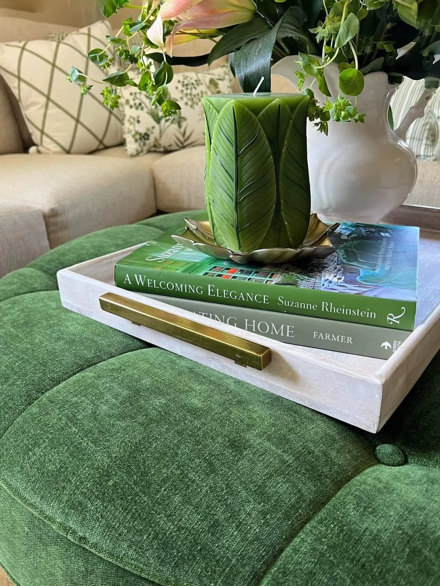 candle and books on a tray for a table/ottoman