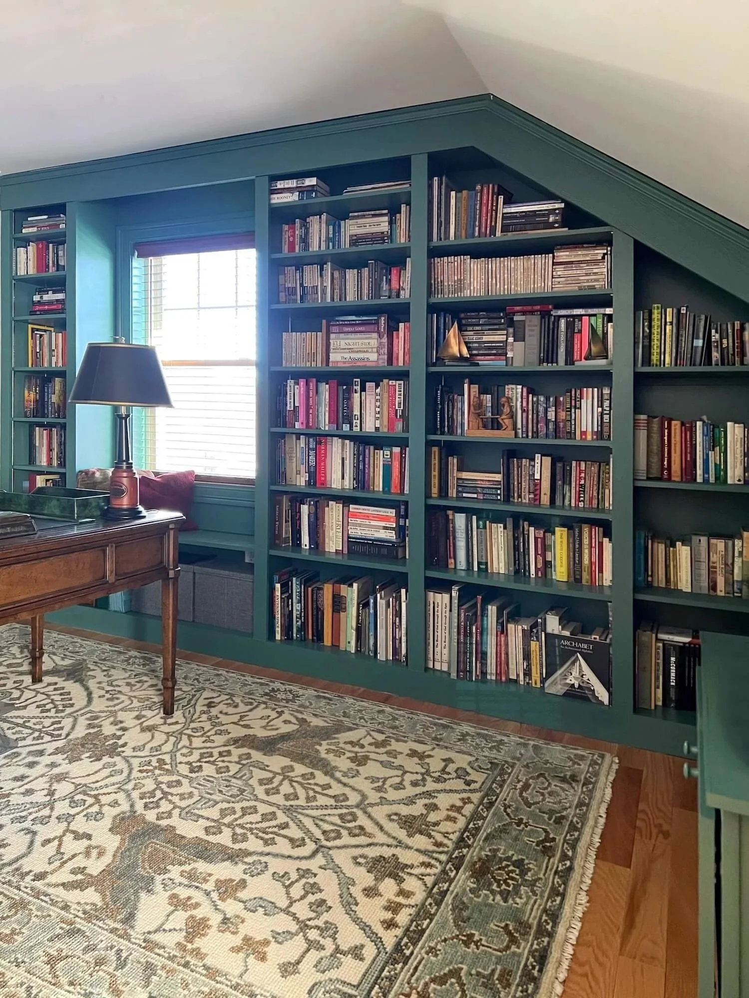 green painted library built-ins