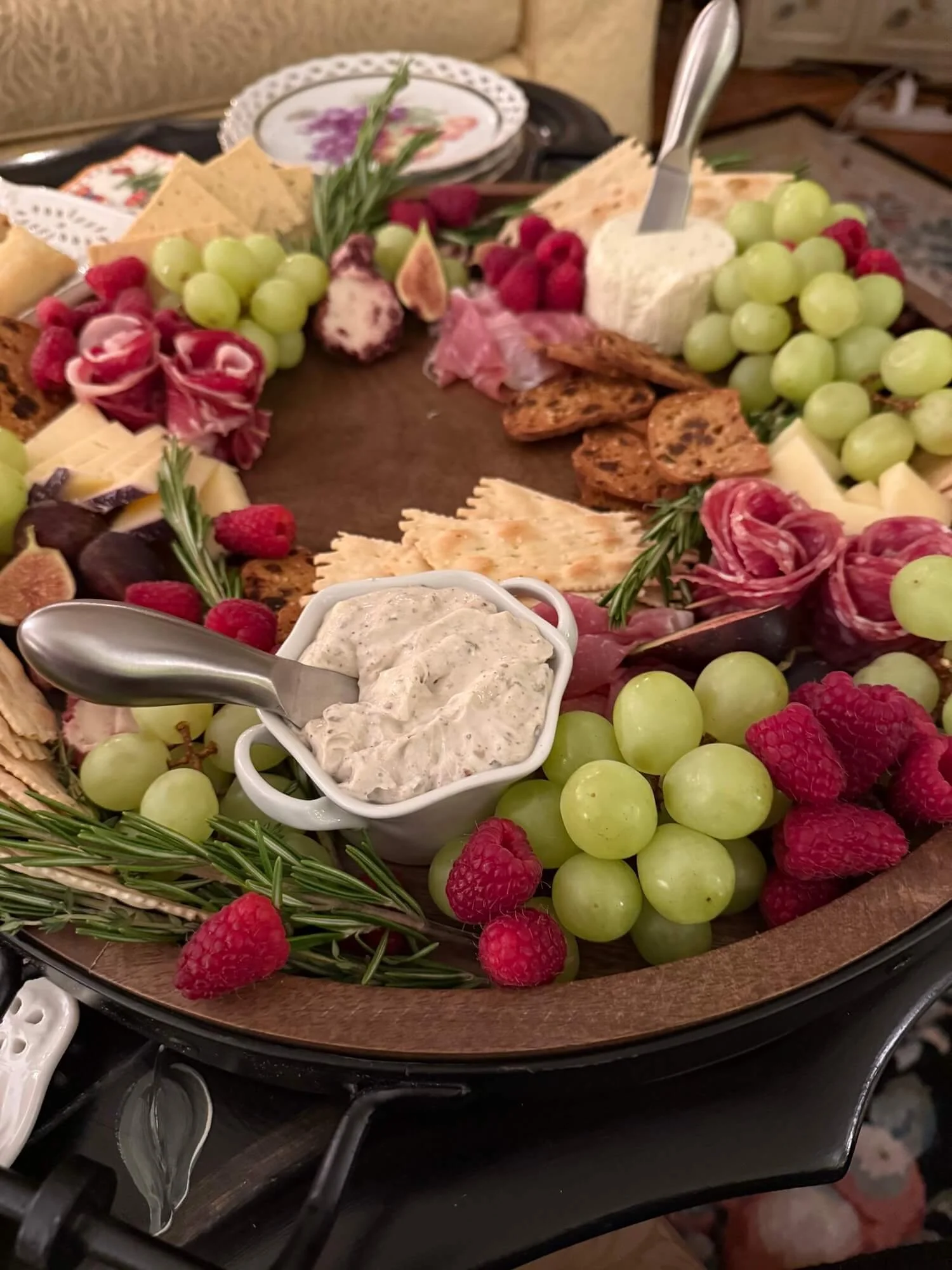 charcuterie wreath on round wooden tray.