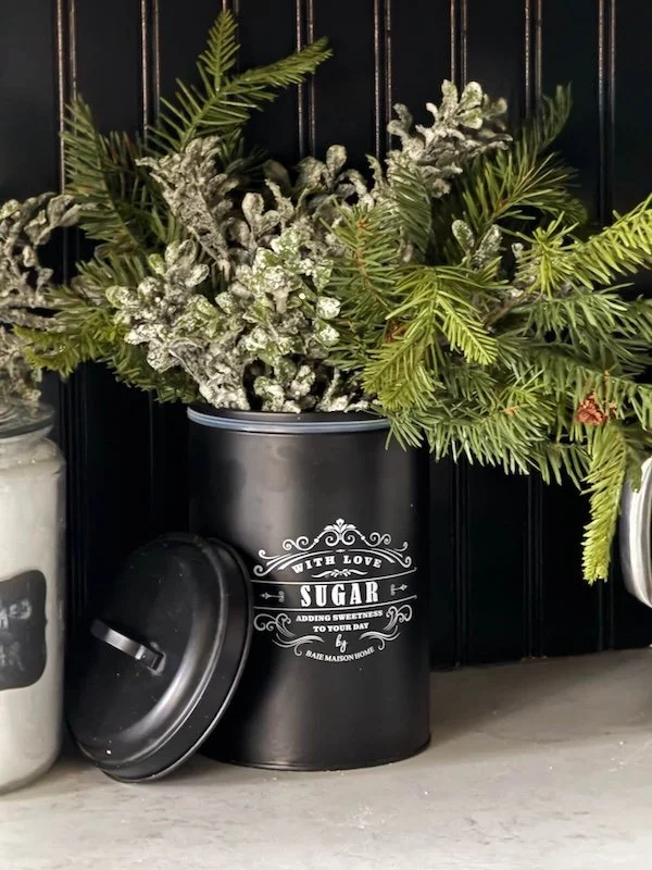 kitchen canister with seasonal greenery